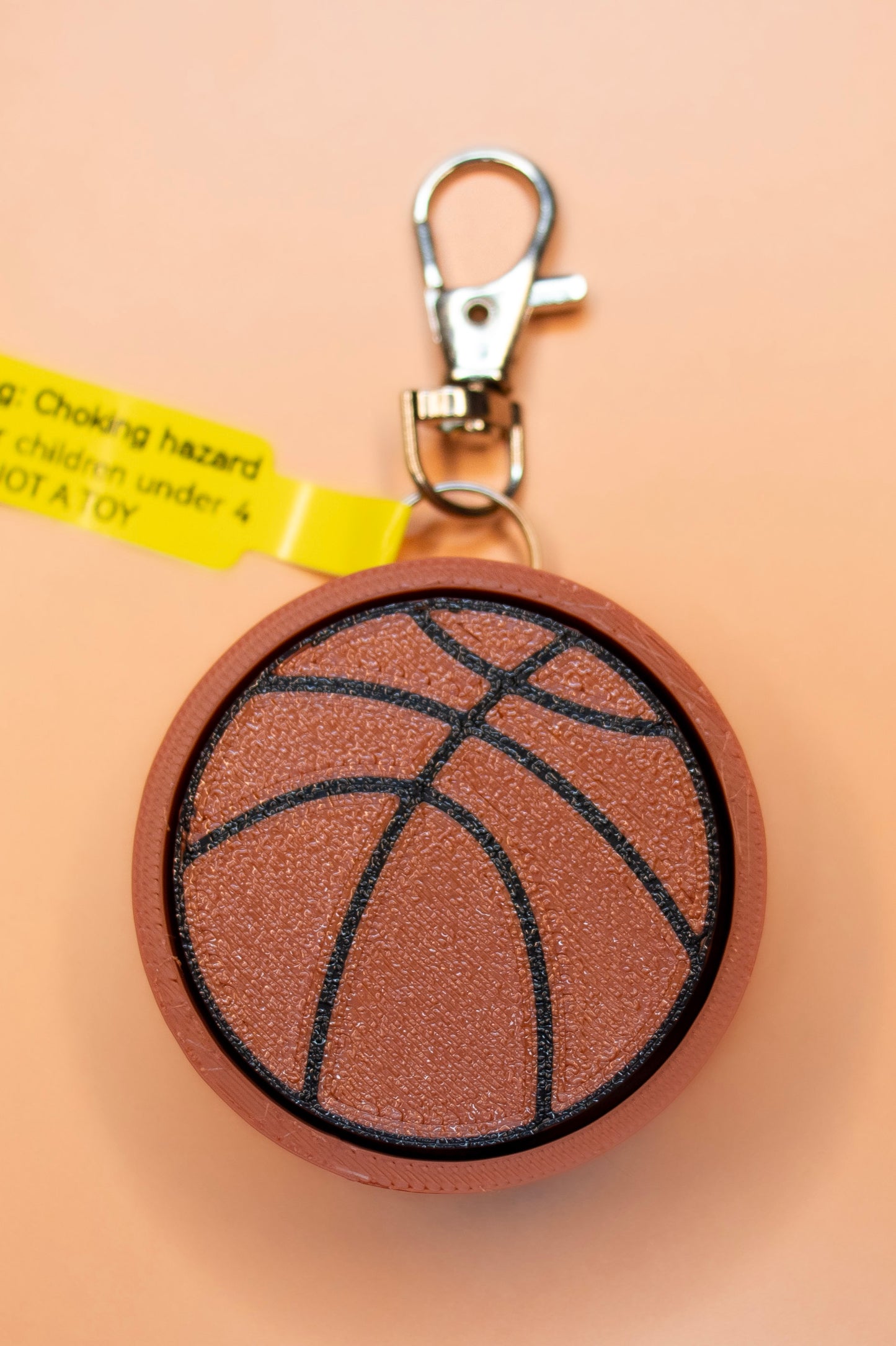 Backetball keychain on orange background