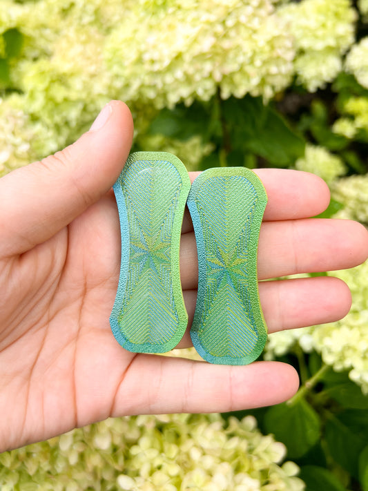 Green magnetic fidget slider on floral background