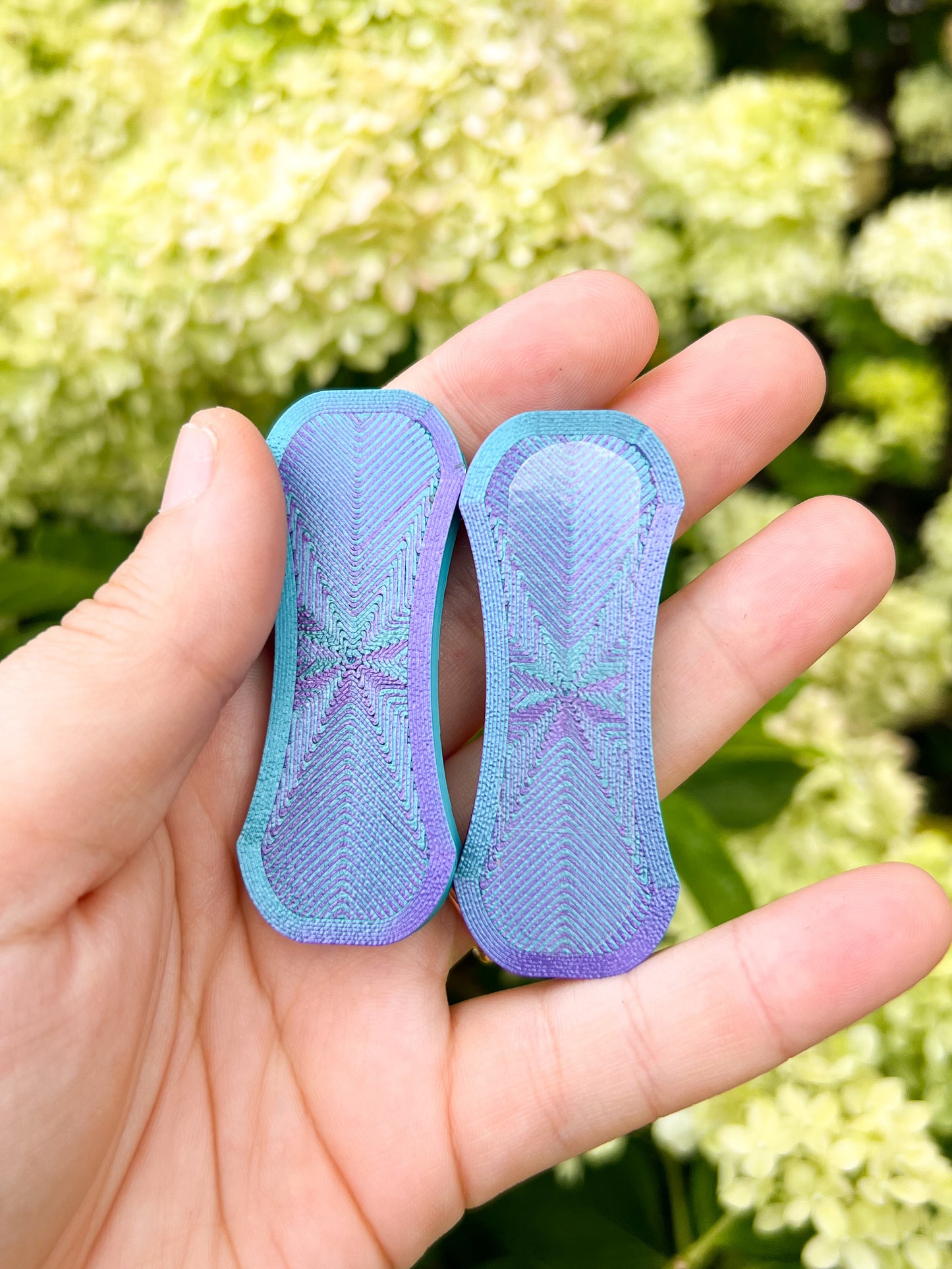 Teal and purple magnetic fidget slider top view
