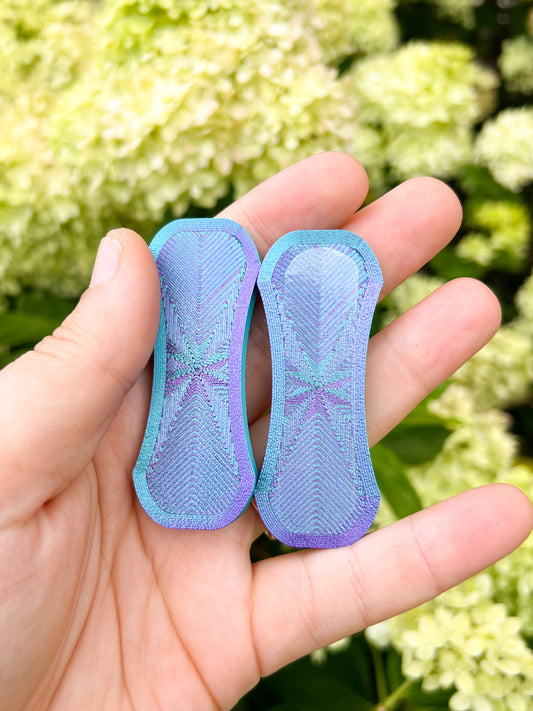 Teal and purple magnetic fidget slider top view
