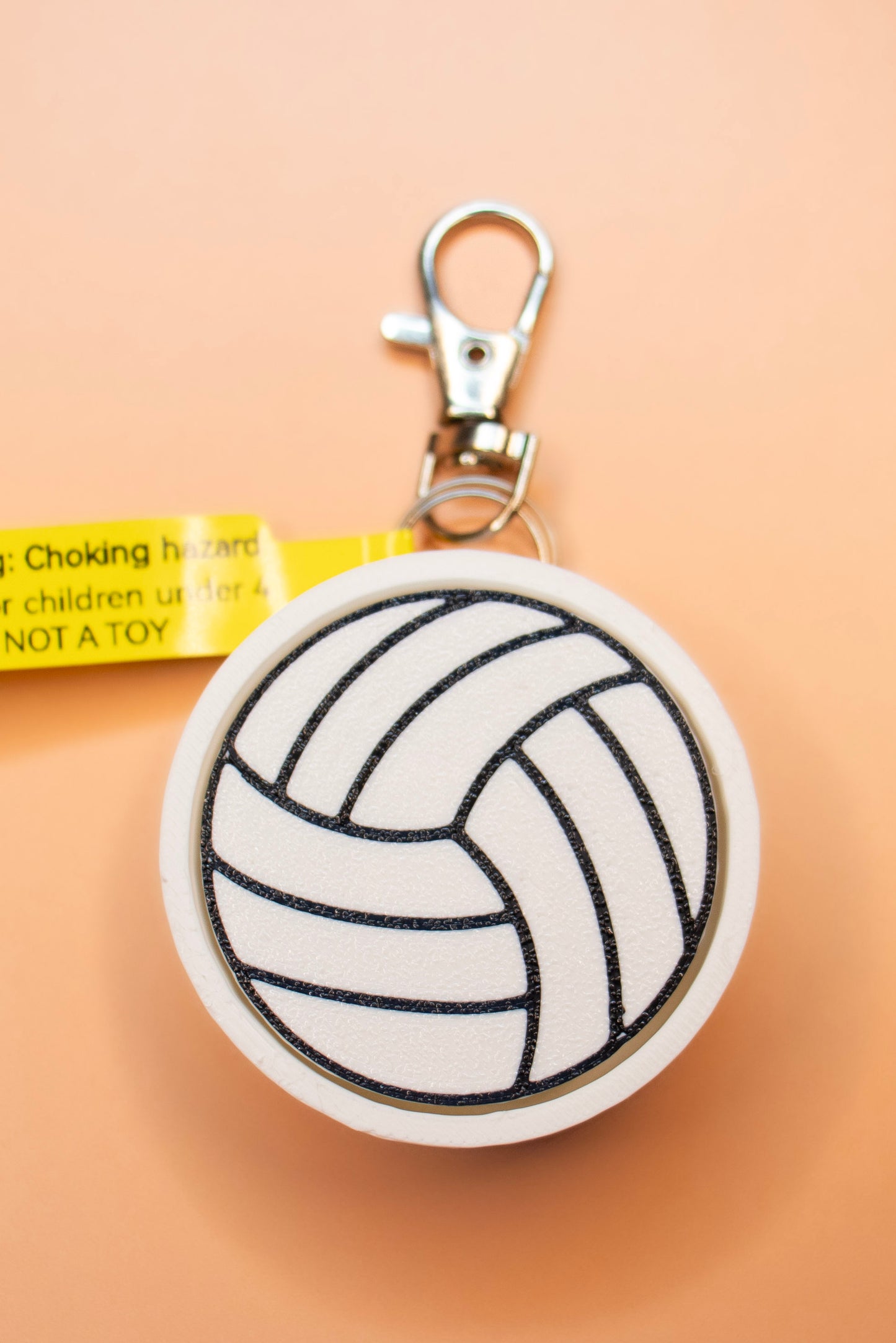Print Pop Volleyball Clicky Keychain on orange background